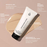 A tube labeled Avocado Zinc SPF 50 Natural Tinted Moisturiser 50ml sits on a beige smear. Text highlights: SPF 50, dewy finish, 100% natural formula, natural coverage, safe for pregnancy and breastfeeding.