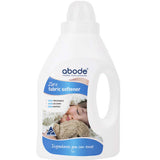 A white bottle of Abode Fabric Softener Zero - Fragrance Free shows a label with a sleeping baby wrapped in a blanket. It’s plant-based, ideal for sensitive skin, and made with “zero nasties” and “ingredients you can trust.”.