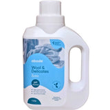 A white 1L bottle of Abode Wool & Delicates Laundry Liquid Zero (Fragrance Free) with a blue label and knitted fabric image. This pH neutral detergent is ideal for washing wool and delicate fabrics.