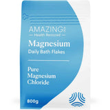 An 800g pouch of Amazing You Daily Magnesium Flakes features a wavy design and blue text, containing pure magnesium chloride flakes for an easy topical magnesium boost.