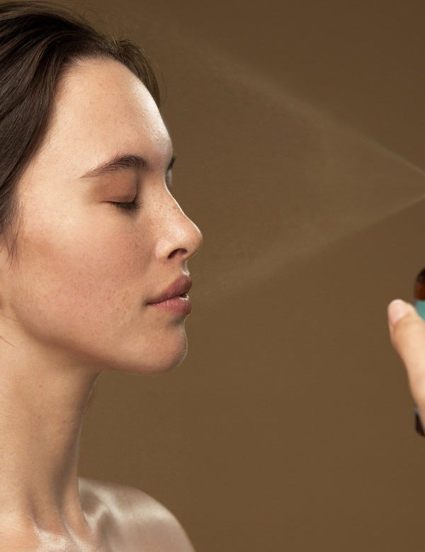 Model misting her face with Antipodes Ananda Ultra-Hydrating Calming Mist