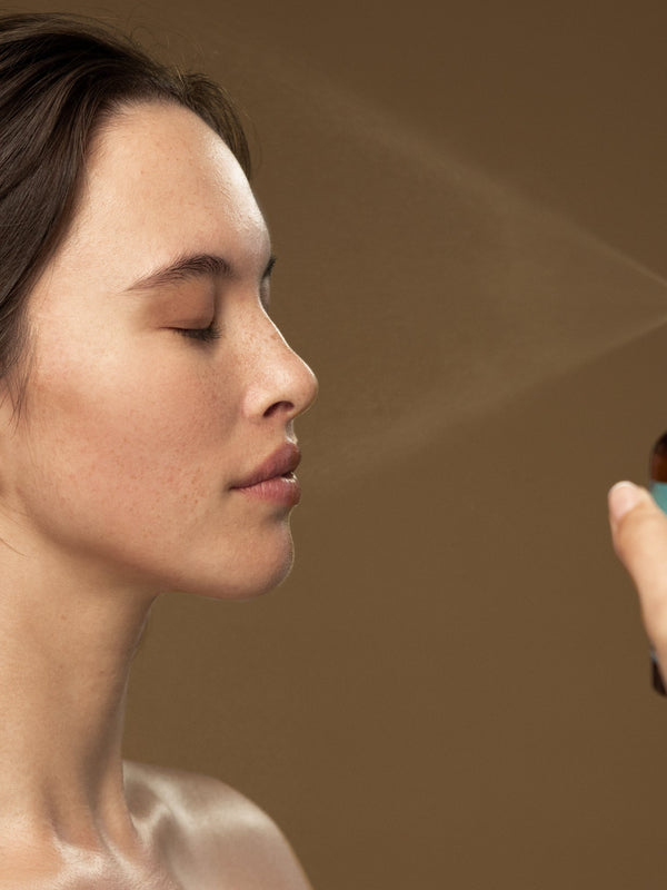 Model misting her face with Antipodes Ananda Ultra-Hydrating Calming Mist