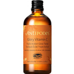 The Antipodes Glory Vitamin C Triple-Action Glow Toner 100ml comes in an amber glass bottle with a black cap and gold label, features vegan approval, highlights Kakadu plum on the front, and is your essential brightening toner.