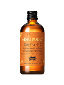 The Antipodes Glory Vitamin C Triple-Action Glow Toner 100ml comes in an amber glass bottle with a black cap and gold label, features vegan approval, highlights Kakadu plum on the front, and is your essential brightening toner.