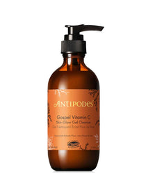 A brown pump bottle of Antipodes Gospel Vitamin C Skin-Glow Gel Cleanser 200ml, featuring an orange and gold floral label, is displayed against a white background.