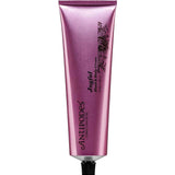 A metallic pink tube of Antipodes Joyful Hand & Body Cream 120ml, featuring black floral graphics and a black screw cap, stands upright against a white background—ideal for vegan skincare and dry skin.