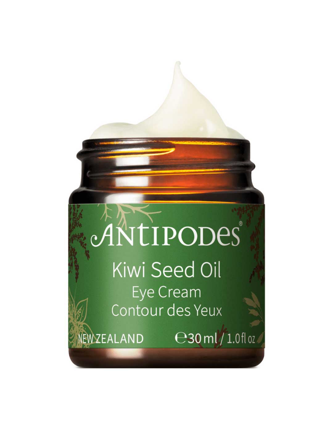A brown jar of Antipodes Kiwi Seed Oil Eye Cream 30ml with green and gold accents contains creamy white natural eye cream. Made in New Zealand, it targets dark circles and comes in a 1.0 fl oz size.