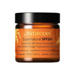 Antipodes Supernatural SPF50+ Ceramide Silk Facial Sunscreen 60ml comes in an amber jar with a black lid and gold and white text, offering broad-spectrum ceramide sunscreen for daily facial protection.