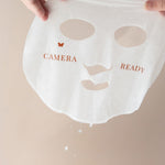 Vanessa Megan Copper and Vitamin C Illuminating Sheet Mask held up