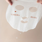 Vanessa Megan Copper and Vitamin C Illuminating Sheet Mask held up