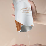 Serum from Vanessa Megan Copper and Vitamin C Sheet Mask poured onto a hand