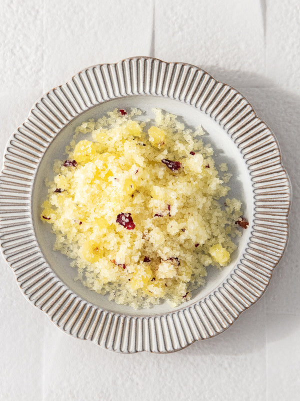 Bowl of Vanessa Megan Love Scrub with sea salt and rose petals