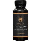 A black bottle of Superfeast Ashwagandha 90 Caps with a gold and white label, containing 90 x 500mg capsules of Withania somnifera root extract for natural stress relief and Ayurvedic support, shown on a white background.