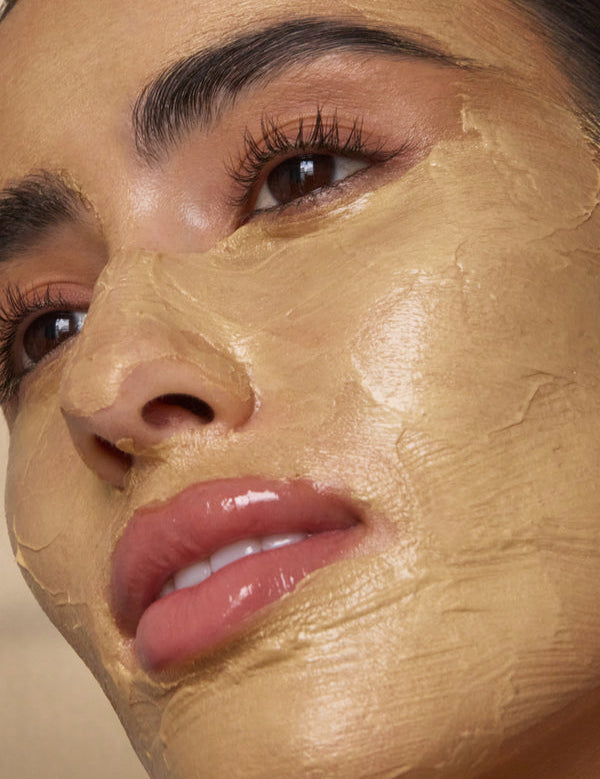 Model wearing Antipodes Aura Gold Manuka Honey Radiance Mask