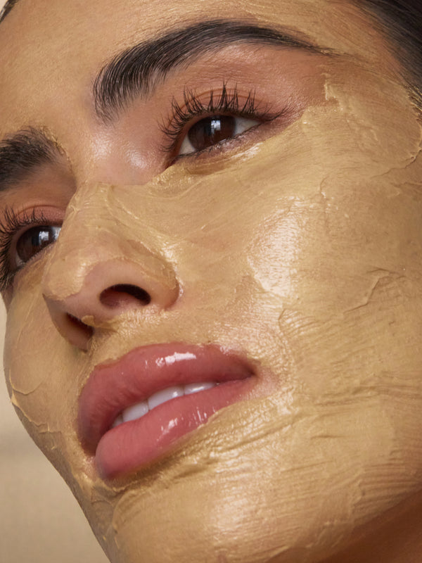 Model wearing Antipodes Aura Gold Manuka Honey Radiance Mask