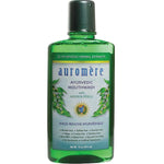 Auromere Ayurvedic Neem & Peelu Mouthwash in a tall transparent green bottle with a dark green cap and a white label with blue lettering and green botanical illustrations.