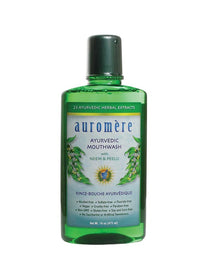 Auromere Ayurvedic Neem & Peelu Mouthwash in a tall transparent green bottle with a dark green cap and a white label with blue lettering and green botanical illustrations.