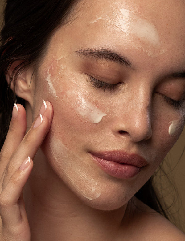 Model applying Antipodes Avocado Pear Collagen-Boosting Night Cream