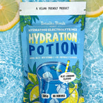 Botanika Blends Blue Lemonade Hydration Potion in water with lemons