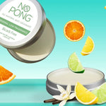 Open silver No Pong Original Low Fragrance Bicarb Free tins showing smooth pale balm against turquoise, surrounded by suspended citrus wedges, a white flower and dark vanilla-like pods.