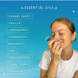 Woman smelling a small tin beside a No Pong essential oils list: sweet orange, vanilla, lemongrass, cedarwood, bergamot, lime, frankincense, ylang ylang and geranium.