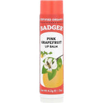 Badger Lip Balm Pink Grapefruit 4.2g features a red cap, organic certification, a grapefruit and flower illustration, and is ideal as a natural lip moisturiser.
