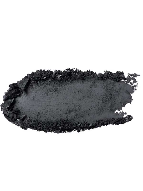 A smear of 100% Pure Fruit Pigmented® Eye Shadow 2g by 100% Pure in black, with rough and uneven edges, appears as a swatch of pigment on a white background.