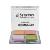 An open Benecos CC Palette 6g features four colour-correcting concealers—purple, peach, beige, and green—in a clear plastic case with the product name on the lid, perfect for natural makeup looks.