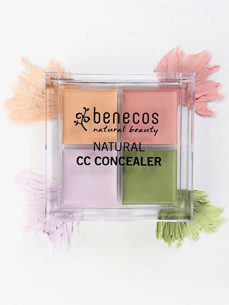The Benecos CC Palette 6g, a colour-correcting concealer with four pastel cream shades—peach, pink, purple, and green—is displayed in a clear case with matching swatches on a white background. Ideal for natural makeup looks.