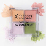 The Benecos CC Palette 6g, a colour-correcting concealer with four pastel cream shades—peach, pink, purple, and green—is displayed in a clear case with matching swatches on a white background. Ideal for natural makeup looks.