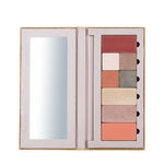 The Benecos Large Beauty ID Palette - Empty is an open, customizable makeup palette with a left-side mirror and space for eight rectangular shades, plus slots for two small applicators beside the shades.