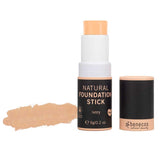 A Benecos Natural Foundation Stick 6g in ivory is shown with the cap removed, revealing the vegan formula. To the left, a swatch displays the natural finish shade.