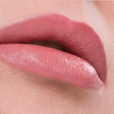 Close-up of lips wearing Benecos Natural Lipsticks 4.5g in a smooth, peach shade, set against a soft, peach-toned background. The word "Peach" appears below the lips.