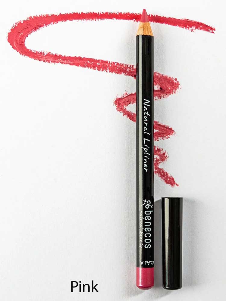 A Benecos Natural Lipliners 1.13g pencil with a pink shade and black cap lies on white paper, labeled "Natural Lipliner." A pink squiggle is drawn above, and the word "Pink" appears below.