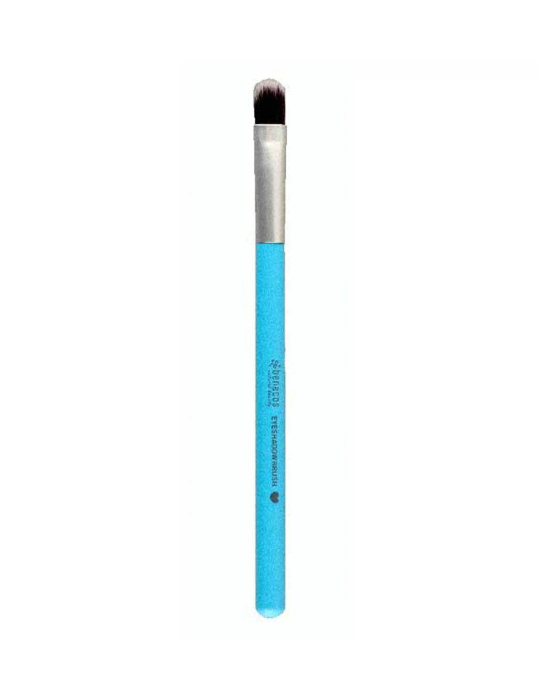 A single makeup brush with a bright blue handle, silver ferrule, and dark brown to black bristles, shown vertically against a plain white background. The brand name 'Staedt' is printed in white on the handle.