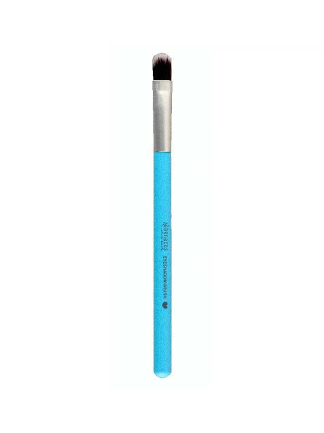 A single makeup brush with a bright blue handle, silver ferrule, and dark brown to black bristles, shown vertically against a plain white background. The brand name 'Staedt' is printed in white on the handle.