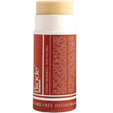 Red deodorant stick with a white cap on a white background