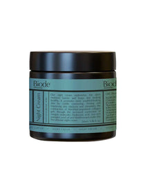 A dark teal and black jar of Biode Night Cream with Hyaluronic Acid 60g features a light teal label highlighting its skin hydration, elasticity, and renewal benefits. This anti-aging night cream provides optimal moisture overnight.