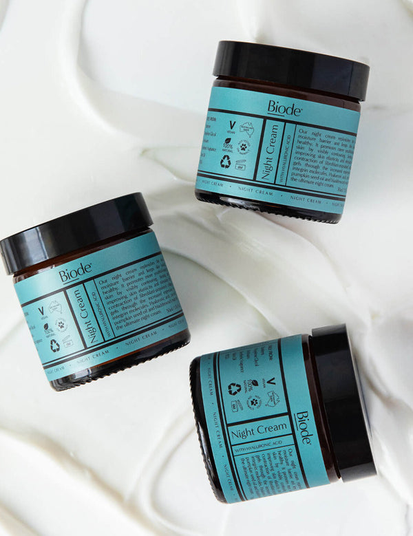 Biode Night Cream styled on white fabric