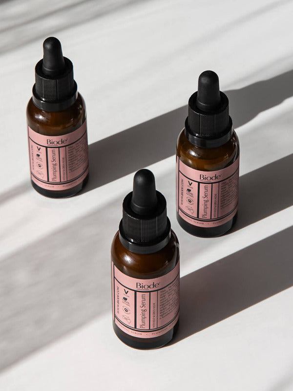 Biode Plumping Serum bottles in sunlight