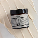 Biode Wild Yam Cream jar on cream texture
