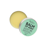 An open tin of Black Chicken Remedies Balm of Ages Multi-Purpose Remedy Balm 60g reveals pale yellow balm inside and a light green lid with product details, crafted from natural ingredients for an effective organic remedy.