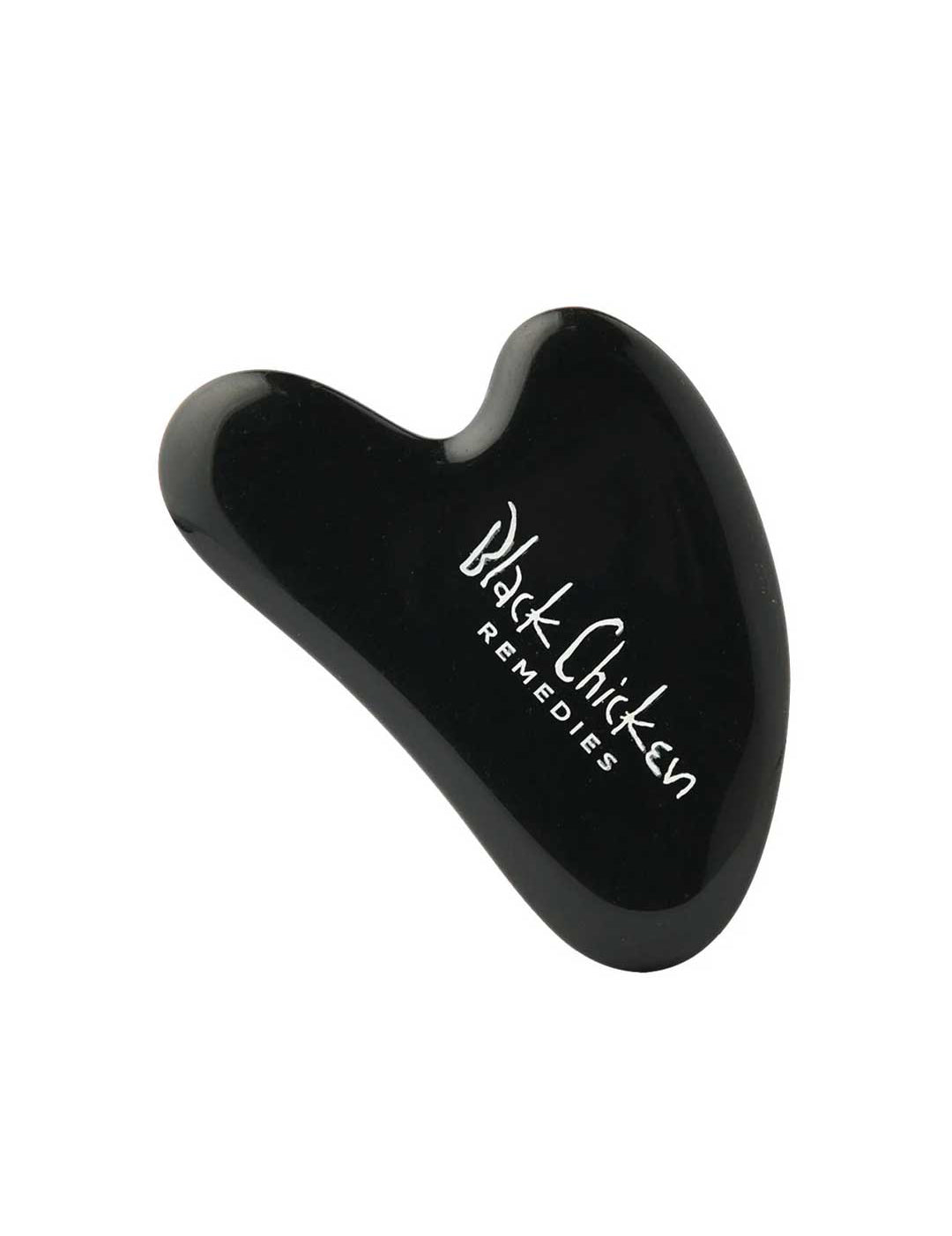 The Black Chicken Remedies Black Obsidian Gua Sha is a sleek black facial massage tool with the brand name in white text, inspired by Traditional Chinese Medicine and shown against a plain white background.