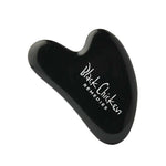 The Black Chicken Remedies Black Obsidian Gua Sha is a sleek black facial massage tool with the brand name in white text, inspired by Traditional Chinese Medicine and shown against a plain white background.