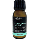 A 30g brown bottle of Black Chicken Remedies Complexion Polish features a black cap and a black, teal, and white label, highlighting its 100% natural rice powder gentle scrub formula.