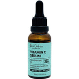 A brown glass dropper bottle labeled Black Chicken Remedies Next Gen Vitamin C Serum 30ml, with a black cap and blue label, contains rejuvenating oil to brighten and improve the health and appearance of sensitive skin.