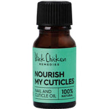 A small brown bottle with a black cap labeled Black Chicken Remedies Nourish My Cuticles Nail & Cuticle Oil 9ml, ideal for nail and cuticle care, rests on a green background.
