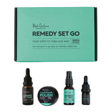 The Black Chicken Remedies Remedy-Set-Go 4pc Travel Pack features a turquoise and black box with two dropper bottles, one spray bottle, and a small jar—ideal for your natural facial skincare routine with essential oils.
