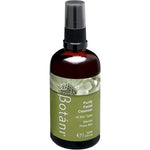 A 100ml amber glass bottle of Botânii Purify Facial Cleanser with a black spray cap and an olive green label, shown on a plain white background.