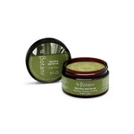 A 250g jar of Botani Spirulina Salt Body Scrub sits open, revealing its green scrub with Australian Sea Salt. Suitable for all skin types.